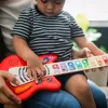 BABY EINSTEIN Hračka dřevěná hudební kytara Together in Tune Guitar™ Connected Magic Touch™ HAPE 6m+