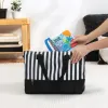 BABY EINSTEIN Knížka měkká s kousátky a texturami Shades of the Sea™, 0m+